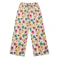 Cream palazzo pants with a large watercolour floral print and tie waist