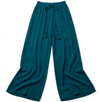 Teal wide-leg palazzo pants with a fluid drape and tasselled drawstring waist