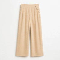 Sand beige pleated wide-leg culottes with buttoned tabs at the waist