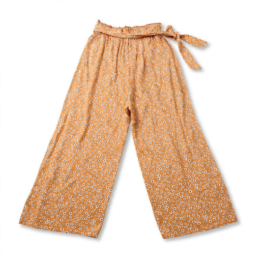 Mustard palazzo pants with a white daisy print, ruffled paperbag waist and side sash