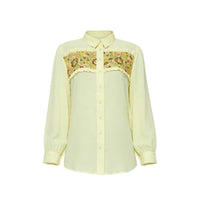 Pale lemon yellow shirt with embroidered floral yoke and ruffle trim