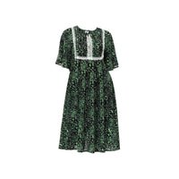 Black and green floral dress with white lace bib panel and flutter sleeves