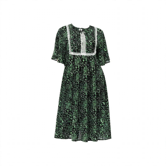 Black and green floral dress with white lace bib panel and flutter sleeves