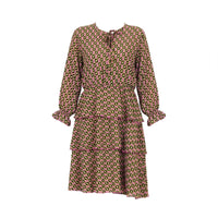 Dusty pink geometric print tiered dress with tie neck and ruffled cuffs
