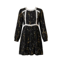 Black and gold marble print dress with white daisy lace bib and waist trim