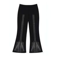Girls' black flared pants with rhinestone bow detail across the flared hem